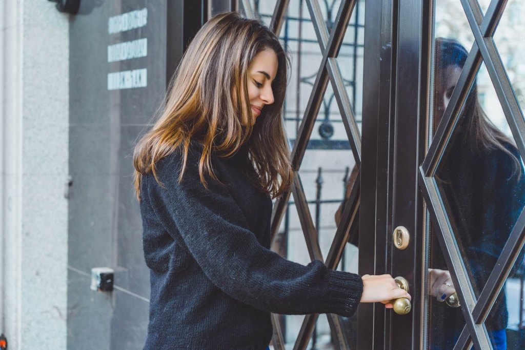girl opens door